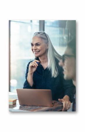 Happy business woman in meeting with coworkers