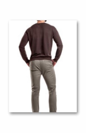 A back view on a modern fit and casually clothed man that stands in a relaxed posture and looks sideways.