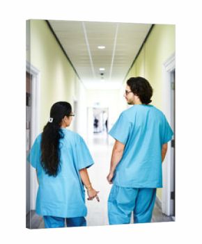 Colleagues walking down the hospital corridor