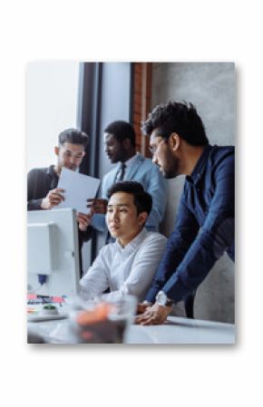 Businesspeople, teamwork. Group of multiethnic busy people working at office, searching information on personal computer and recording data on flip chart.