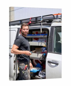 Electrician with work tool and van