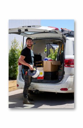 Electrician loading his work van