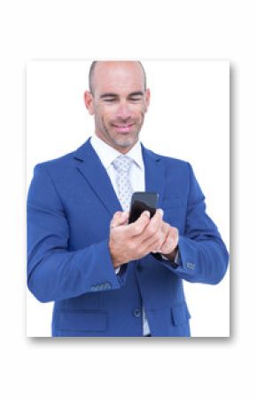 Smiling businessman using mobile phone 