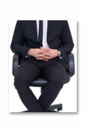 Stern businessman sitting on an office chair 