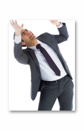 Scared businessman with arms raised