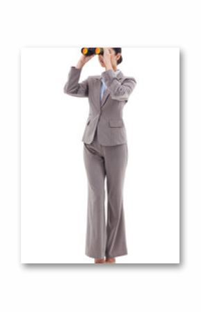 Portrait of a brunette businesswoman looking through binoculars