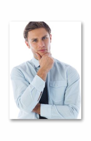 Thinking businessman with hand on chin