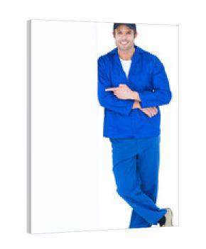 Confident mechanic pointing at bill board