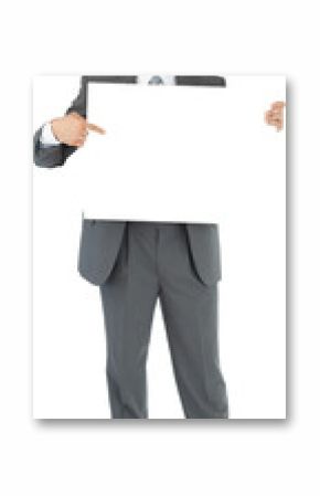 Businessman pointing at sign he is holding