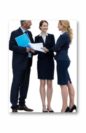 Businessman discussing with female colleagues standing against white backfround