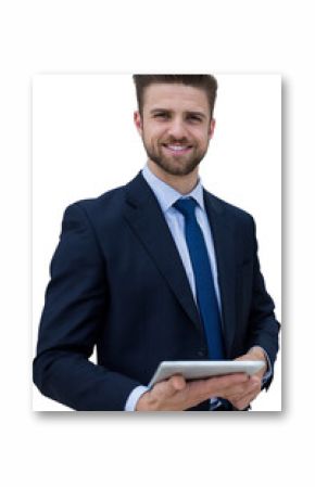 Portrait of smiling businessman holding digital tablet