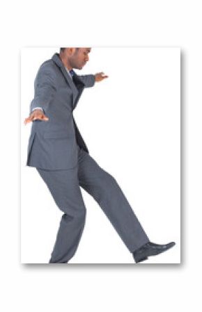 Businessman performing a balancing act