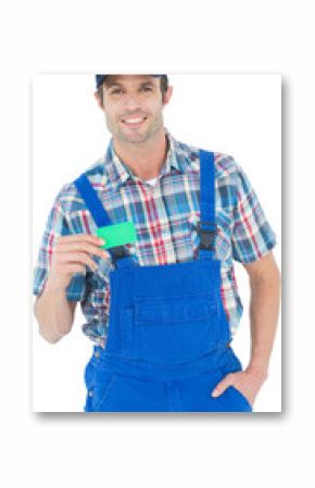 Confident plumber showing green card
