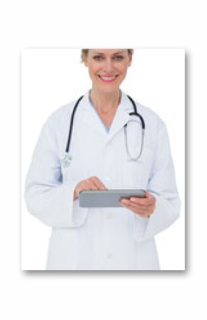 Blonde doctor using tablet pc