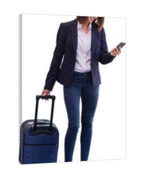 Smiling businesswoman looking at mobile phone while carrying bag