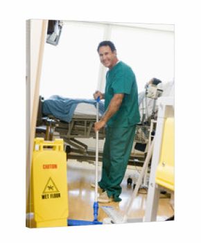 An Orderly Mopping The Floor In A Hospital Ward