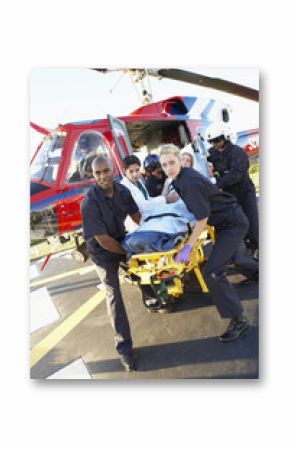 Paramedics unloading patient from Medevac