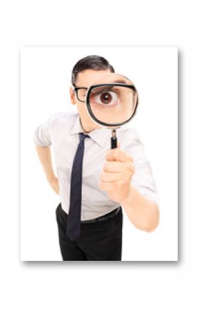 Man looking through a magnifying glass