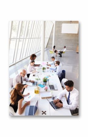 Overhead View Of Business Meeting Around Boardroom Table