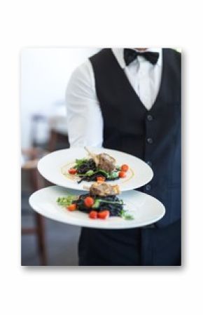 Waiter showing a dish