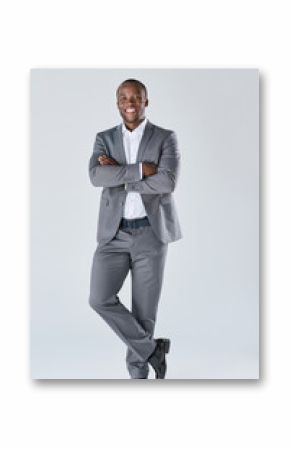 Confident friendly business man smiling in studio full length