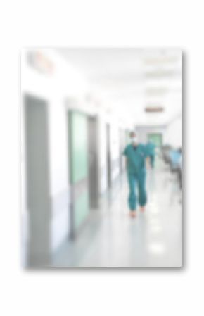 Doctors and nurses walking in hospital hallway, blurred motion.