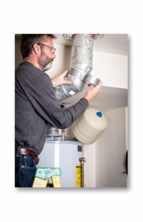 Plumber applies tape on duct work