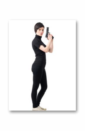 Side view of armed tough woman holding gun looking at camera. Full body length portrait isolated over white studio background.