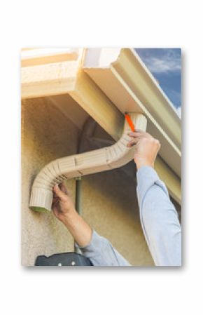 Worker Attaching Aluminum Rain Gutter and Down Spout to Fascia of House.