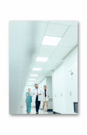 Medical team in hospital corridor discussing work
