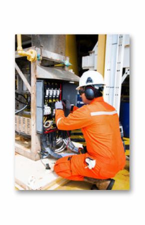 Electrical and instrument technician maintenance electric system of pressure or temperature transmitter at oil and gas processing platform