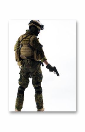 Full length back view confident soldier shooting with pistol. Army concept