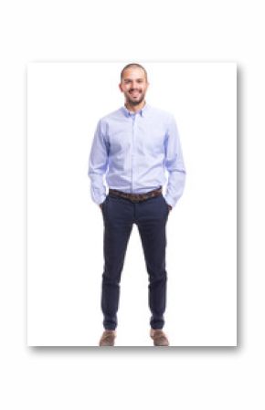 Portrait of young business man standing with hands in pockets on a white background
