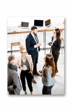 Business people having a conversation during the coffee break standing in the cafe