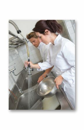 kitchen clerks washing the dishes
