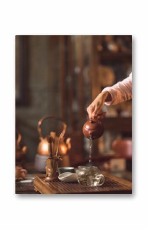 Master pouring tea from a teapot