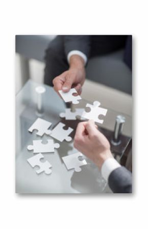 business partners put the pieces of the puzzle.