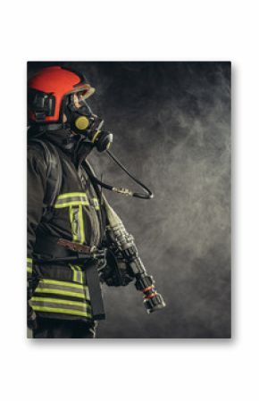 strong firefighter in protective suit and helmet use special equipment for preventing fire and save people and animals from fire