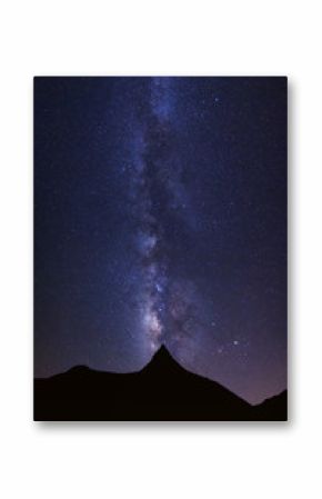 Starry night sky with high moutain and milky way galaxy with stars and space dust in the universe