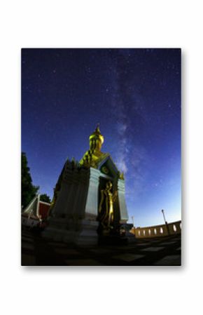 Milky Way Galaxy with Standing gold Buddha image name is Wat Sra Song Pee Nong in Phitsanulok, Thailand