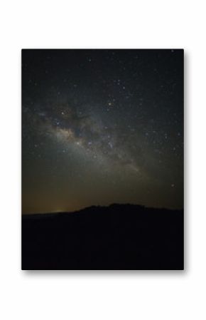 Milky Way over mountain at Phu Hin Rong Kla National Park,Phitsanulok Thailand, Long exposure photograph.with grain