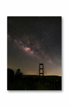 Milky way over rope bridge, Long exposure photograph.with grain