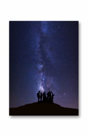 Landscape with milky way, Night sky with stars and silhouette of happy people standing on high moutain