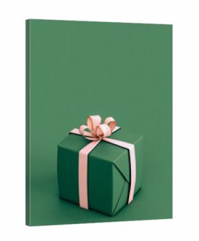 Green and pink christmas gift on green background