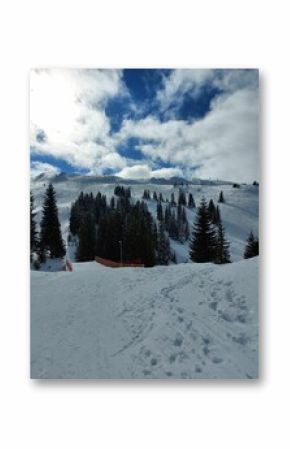 Jahorina, Bosnia and Hercegovina in a snowy environment with trees and clouds