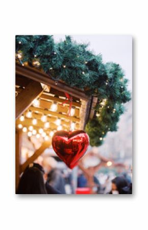 Red heart ornament decoration detail on a Christmas market