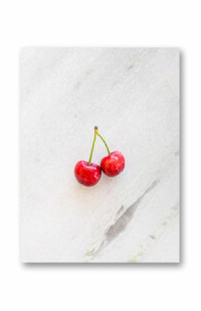 Bright Red Pair of Cherries on Marble Surface