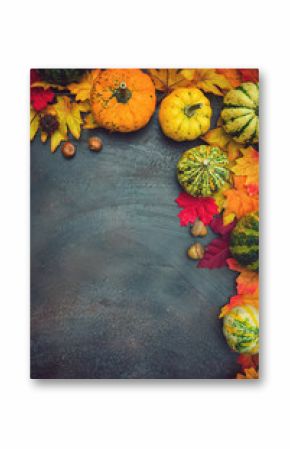 Autumn background with colorful leaves and pumpkins