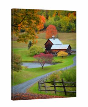 Barn in Vermont country side surrounded by autumn trees