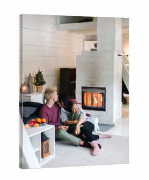 Cuddling couple in cozy house